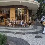 Leblon Beach in Rio de Janeiro with mountain and ocean views.